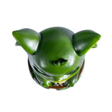 Green dragon-imp creature in a pot, shown top down