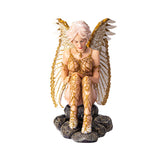 Figurine of a nude angel in gold accents with pale hair and white wings