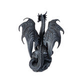 Figurine of a dragon, faux-stone black-gray coloring. Shown from the back