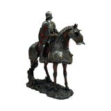 A detailed equestrian statue of a knight in full armor riding a horse
