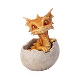 A small orange-brown dragon figurine peeking out of a cracked beige egg, photographed on a clean white background.