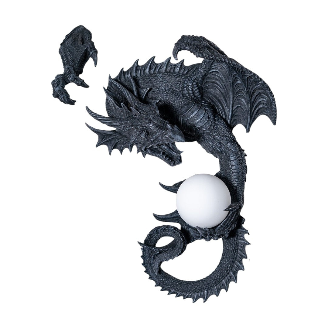 Dark gray faux-stone wall mounted lamp shaped like a dragon with an orb that glows