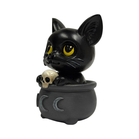 Figurine of a black cat in a cauldron with a skull