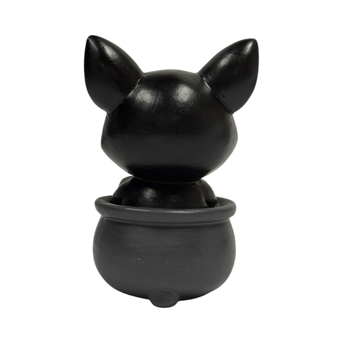Figurine of a black cat in a cauldron with a skull, shown from the back