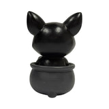 Figurine of a black cat in a cauldron with a skull, shown from the back