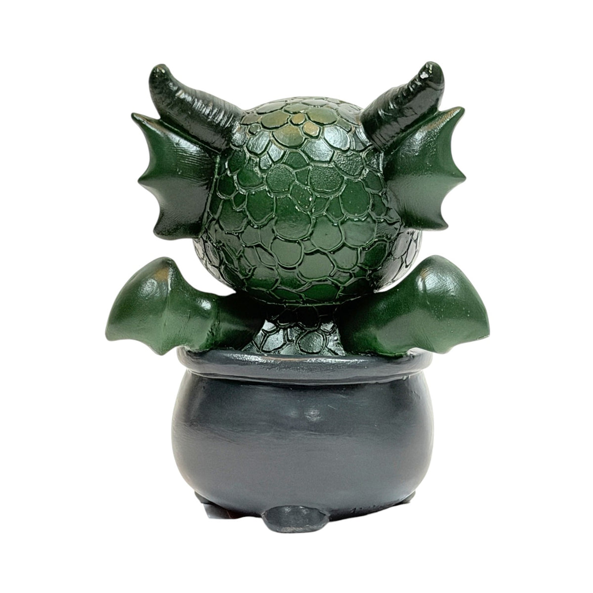 Figurine, green dragon in black cauldron with moon designs, shown from the back
