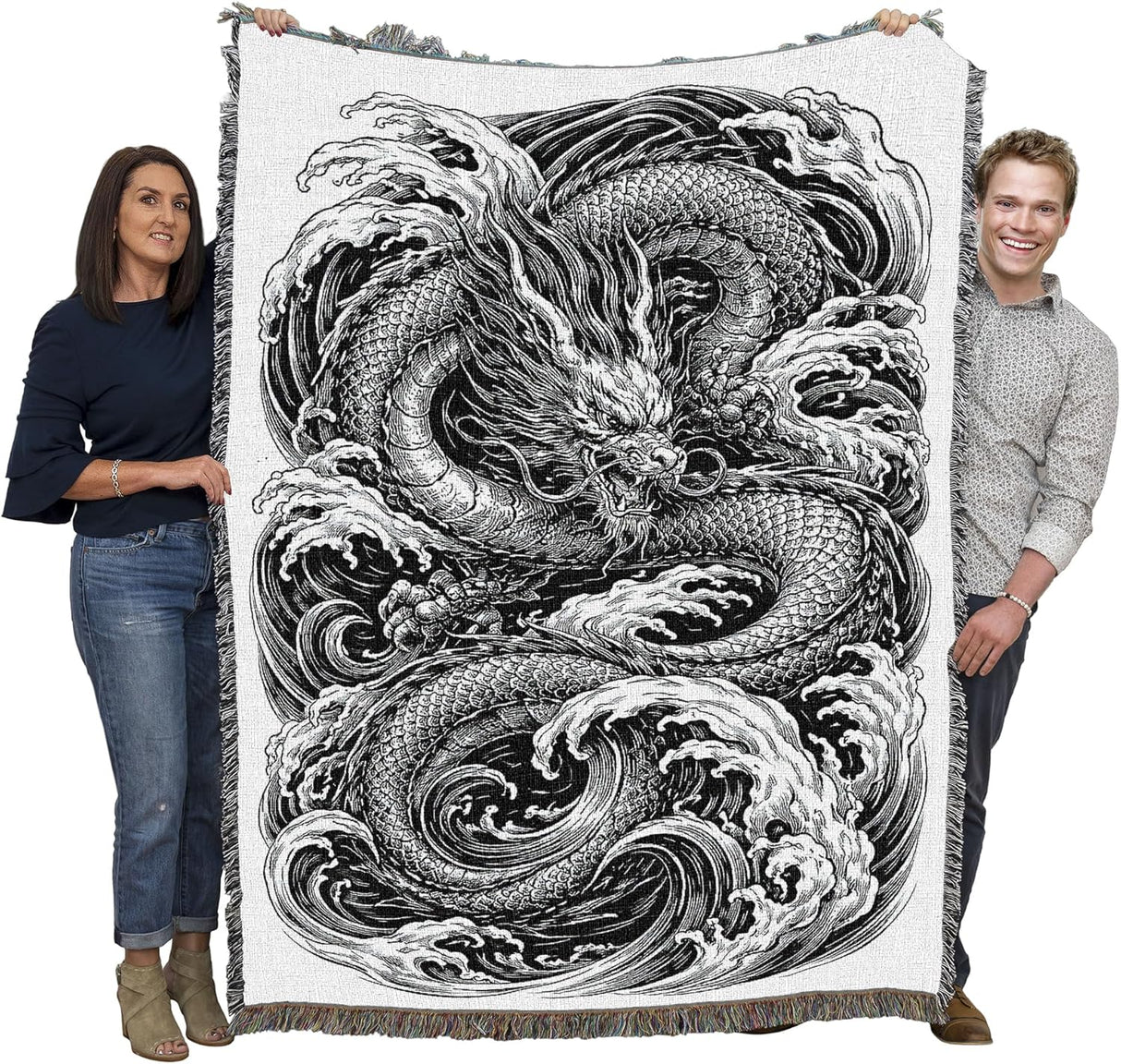 Tapestry blanket in black and white with water dragon, held by two adults