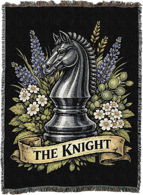 Decorative blanket with a knight chess piece and floral design on a black background