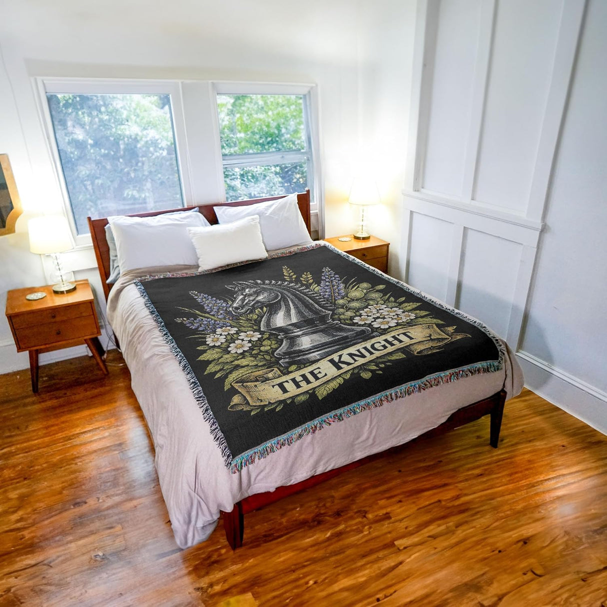 Bedroom with a bed featuring a decorative blanket with 'The Knight' design.
