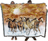Tapestry blanket with herd of horses running under sunset, held by two adults to show large size