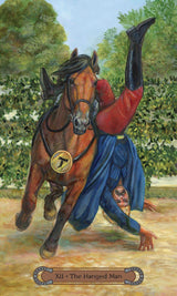 Unbridled Spirit Tarot Deck & Guidebook set - The Hanged Man card with bay horse nd man half off the horse