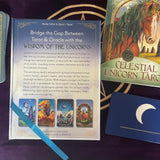 Unicorn-themed tarot cards with a guidebook on a purple surface