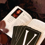 The Oracle of the Vampire Fae showing open guidebook and cards