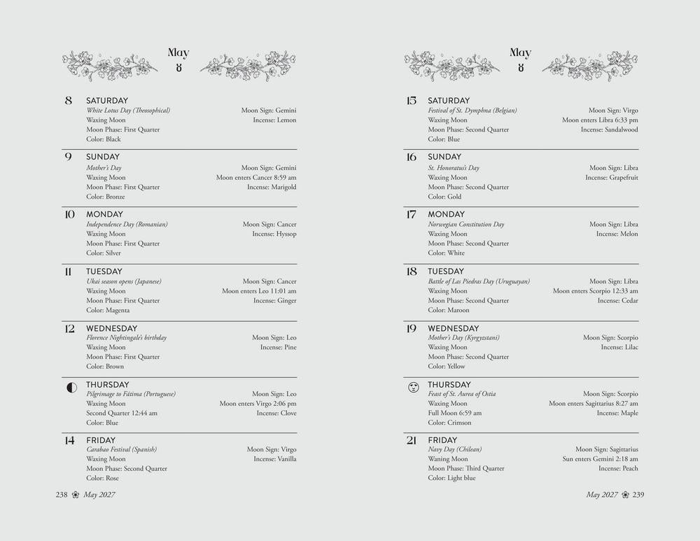 A two-page spread of a printed calendar or planner layout for May, with decorative floral flourishes at the top of each page and daily time blocks from Saturday through Friday below.