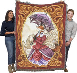 Tapestry blanket showing fox woman in Victorian dress with parasol, held by two adults to show large size