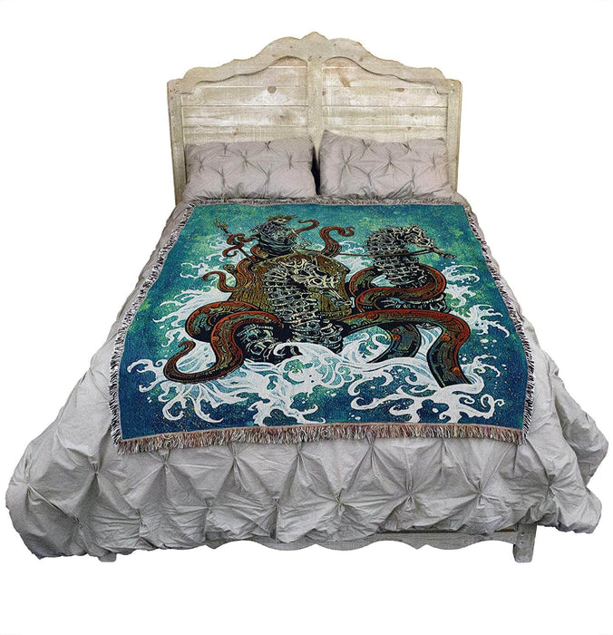 Tapestry blanket shown draped over a bed