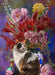 Finished jigsaw puzzle design of a calico cat sitting in front of an ornate vase of flowers, with another smaller vessel nearby