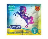 Breyer Stablemates Mystery Unicorn Surprise, front of bag with a unicorn design on a blue and yellow background.