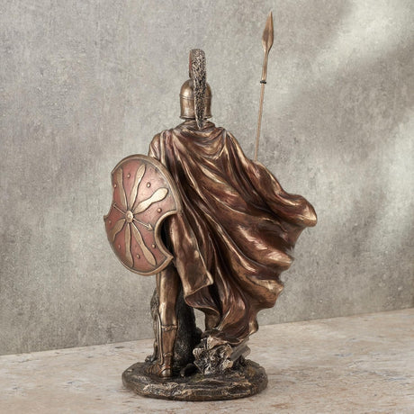 Bronze hued statue of Odysseus in armor with a spear and his dog, Argus. Shown from the back