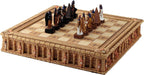 Egyptian chess set shown with main pieces faces one another, black and gold teams on an ornate Ankh board
