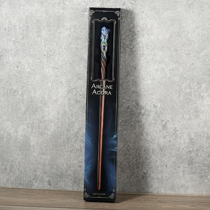 Blue peacock feather wand with gem shown in box