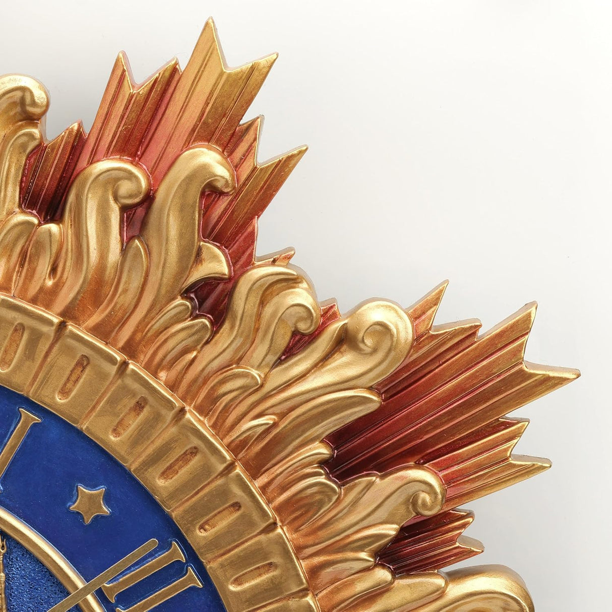 Close-up of a decorative clock with gold design and blue