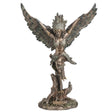 Statue of a feather winged harpy woman on a tree stump with talon feet