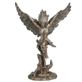Statue of a feather winged harpy woman on a tree stump with talon feet