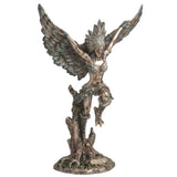Statue of a feather winged harpy woman on a tree stump with talon feet