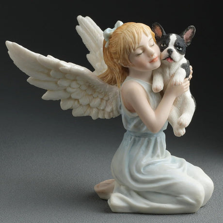 Angel figurine holding a small French Bulldog