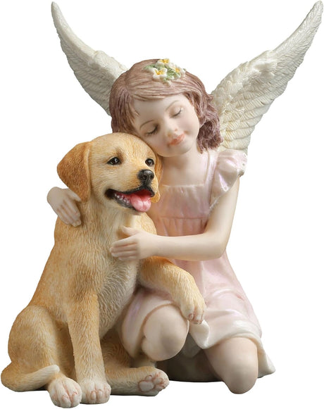 Statue of a girl with angel wings hugging a dog 