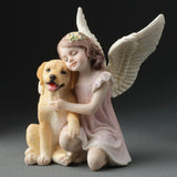 Angel figurine, angelic girl hugging a golden retriever puppy dog