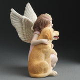 Angel figurine, angelic girl hugging a golden retriever puppy dog, shown from the side