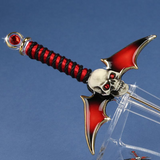 Glass sword with winged skull hilt in red and black with crystals