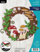 Felt wreath kit with mushrooms and flowers, featuring Bucilla branding.