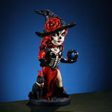 Figurine of witch in red and black with cat and crystal ball, Day of the Dead face paint