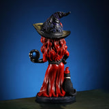 Figurine of witch in red and black with cat and crystal ball, Day of the Dead face paint, shown from the back