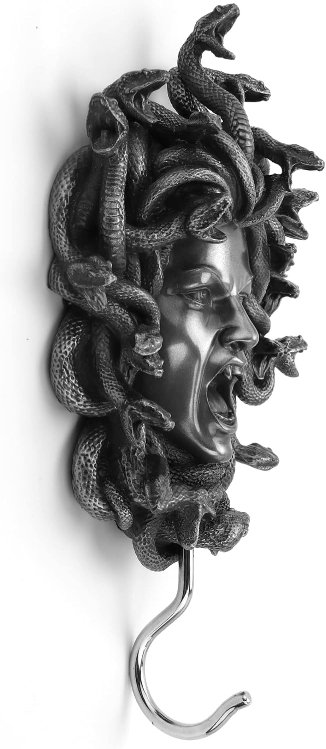 Decorative wall hook with Medusa head design on a white background