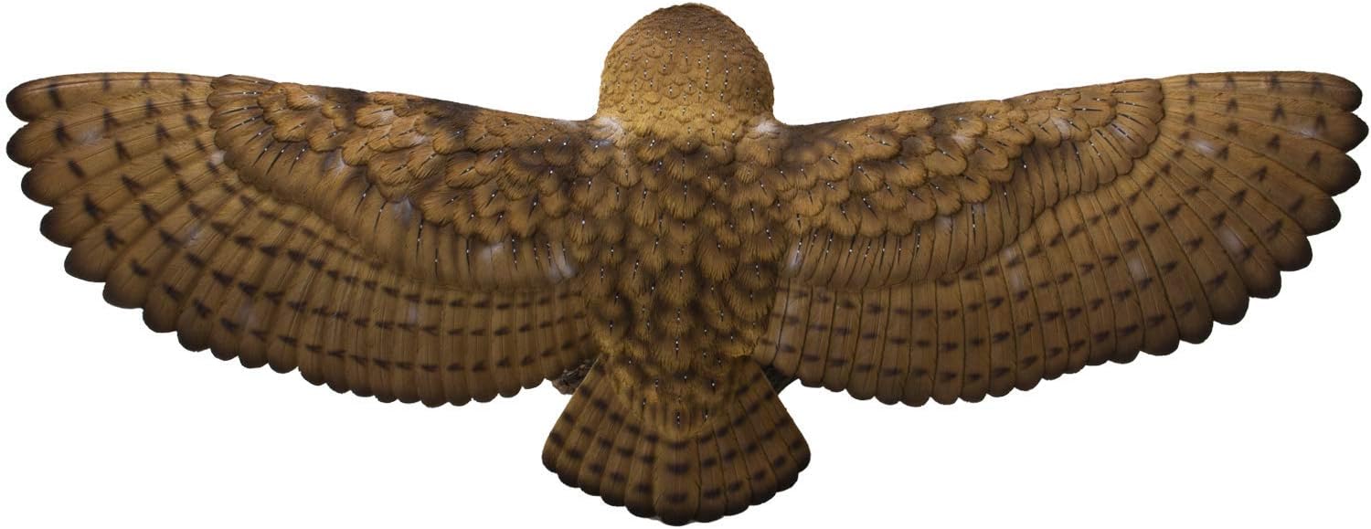 Flying barn owl figurine with brown and white feathers, shown from the back