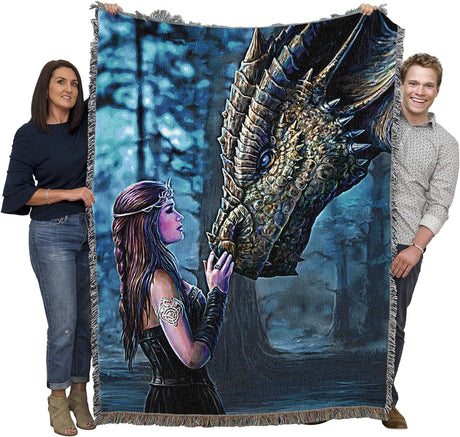 Two adults holding up tapestry blanket to show large size