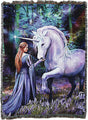Tapestry blanket with unicorn and maiden in bluebell-filled forest meadow