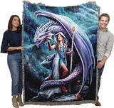 Tapestry Blanket, art by Anne Stokes. Sorceress holding staff, with red hair, standing with a dragon. Held by two adults to show size