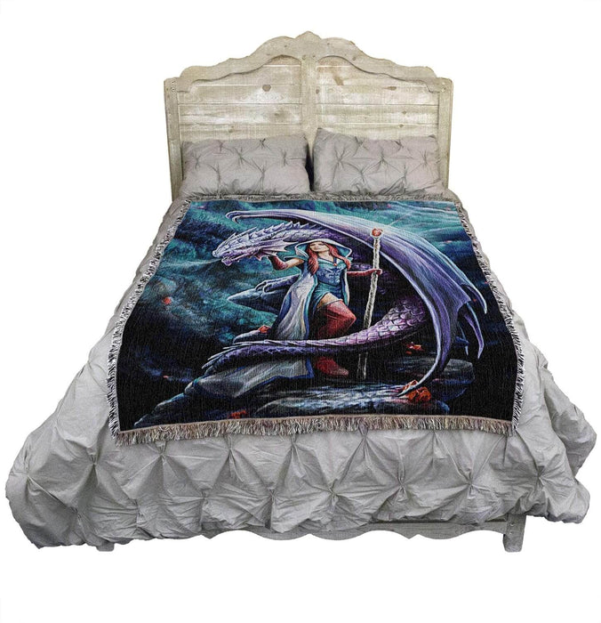 Tapestry Blanket, art by Anne Stokes. Sorceress holding staff, with red hair, standing with a dragon. Shown on a bed.