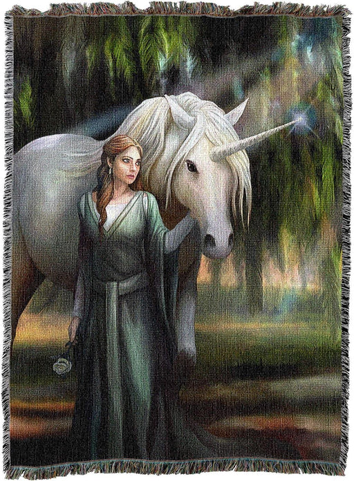 Tapestry blanket with art by Anne Stokes featuring a woman in green with a unicorn standing amidst mossy trees.