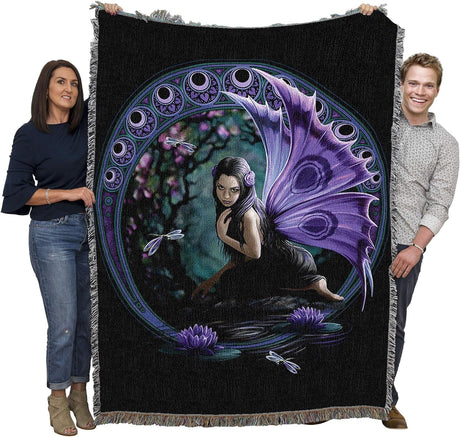 Tapestry blanket held by two adults to show large size