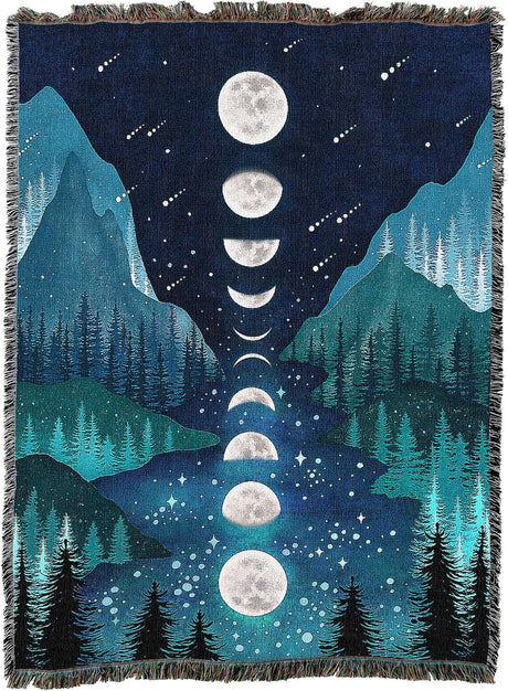 Woven blanket with moon phases and mountain landscape design