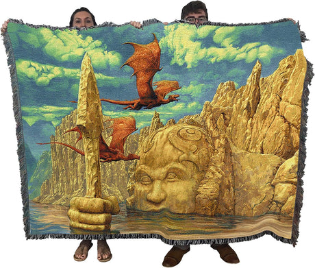 Tapestry blanket by Ciruelo, two red dragons flying across golden cliffs of a lake temple