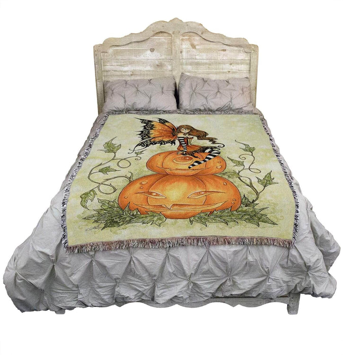 Pumpkin Fairy blanket shown on a bed