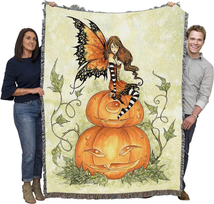 Pumpkin Fairy tapestry held up by two adults to show large size