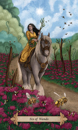 Card from a tarot deck featuring a woman on a horse with flowers and bees.